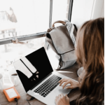 woman on a computer, The Best Uses for a Press Release According to a Publicist