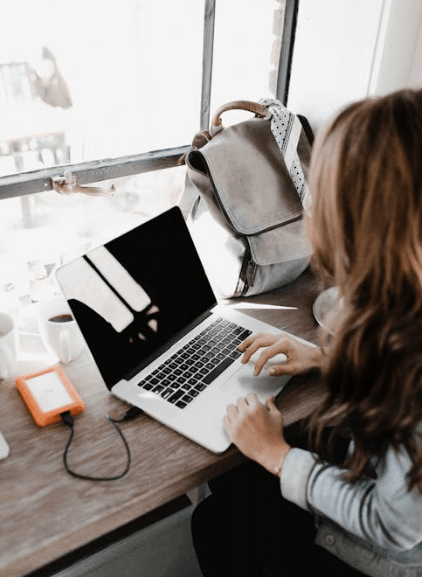 woman on a computer, The Best Uses for a Press Release According to a Publicist
