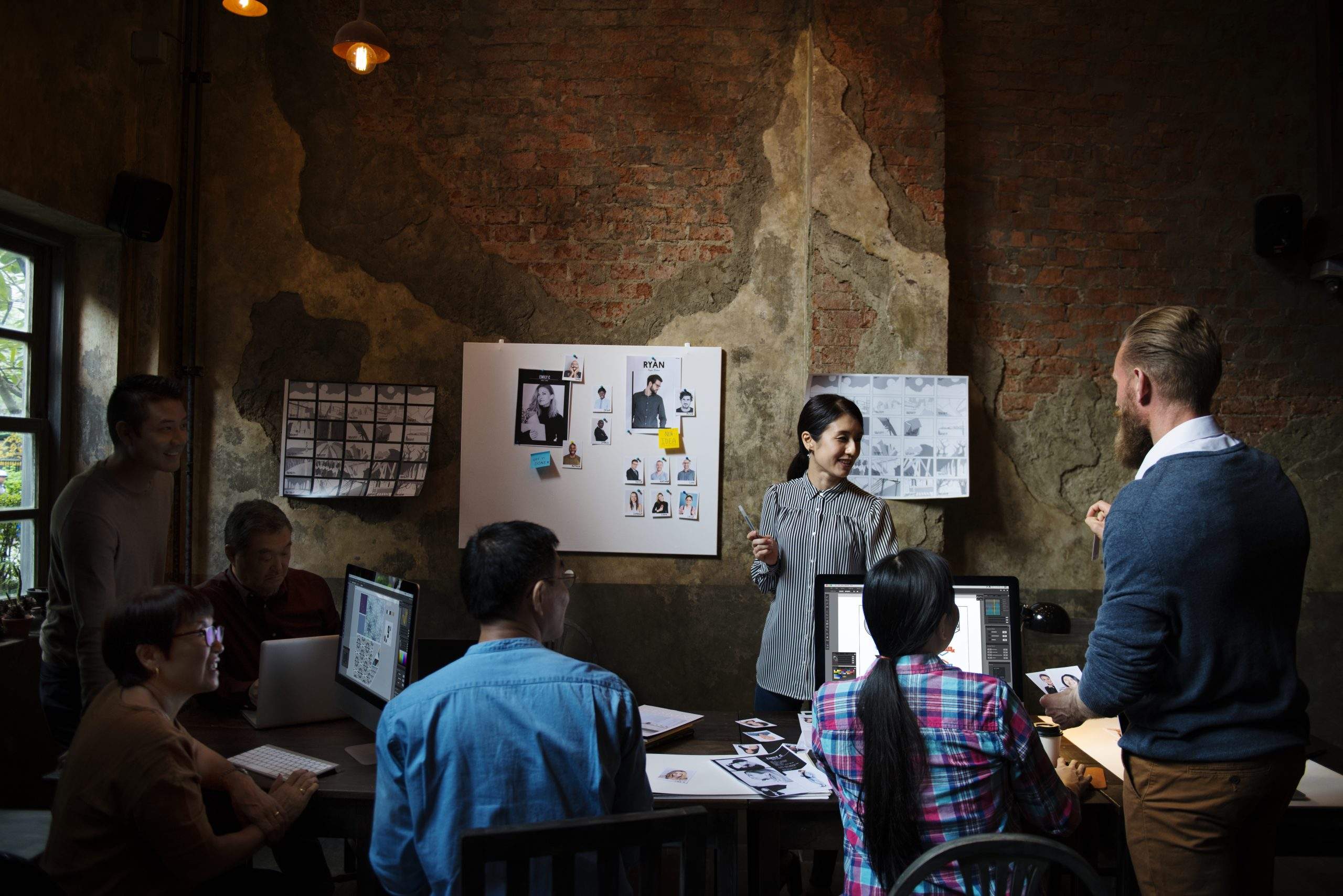 Creative team reviewing how to refresh your brand story for modern relevance