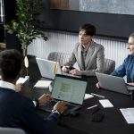 Team discussing how internal communication shapes brand reputation during a company meeting