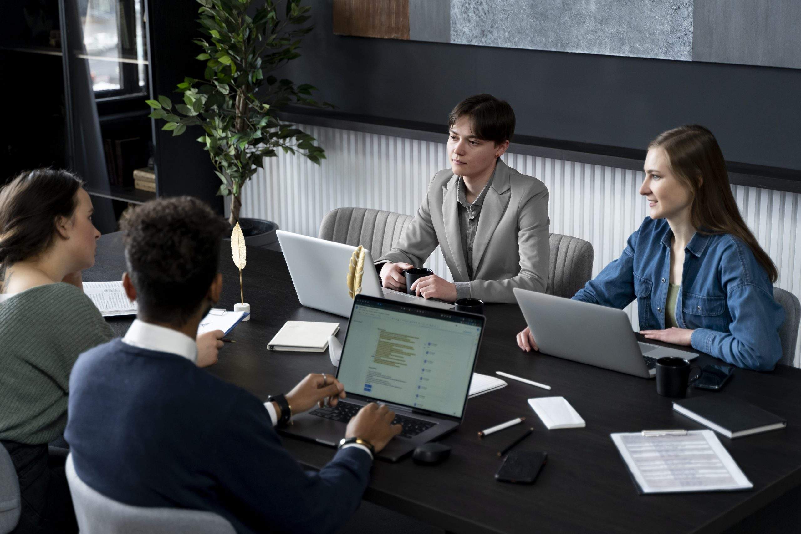Team discussing how internal communication shapes brand reputation during a company meeting 